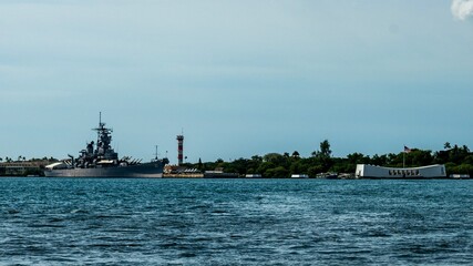 Battleship museum ship and the Arizona Memorial across Pearl Harbor © Ben