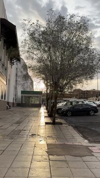 Cars parked outside masjid al qiblatain along the street in medina.
