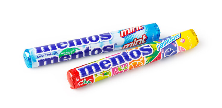 Mentos mint and rainbow fruit chewy dragees rolls on a white background