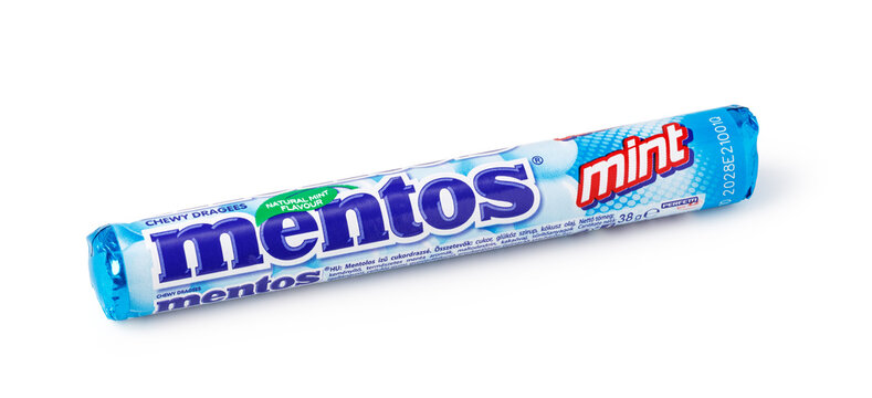 Mentos mint flavored chewy dragees candy roll on a white background