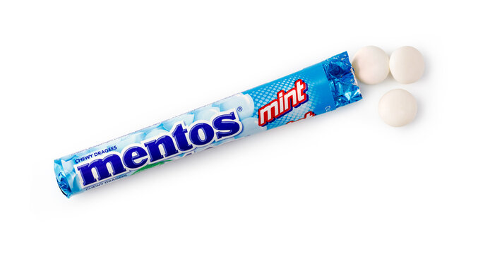 Mentos mint chewy dragees with blue wrapper on a white background