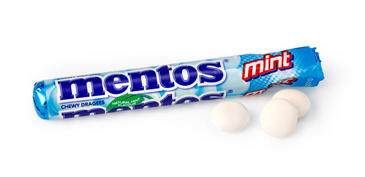 Mentos mint chewy dragees with packaging on a white background
