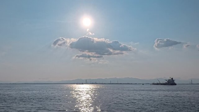 Dynamic daybreak seascape with silver lining clouds and sparkling reflection for inspirational video, brand ad, and success