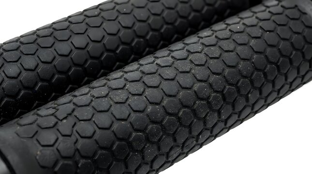 Black hexagonal textured foam roller for muscle recovery, massage therapy, and fitness training applications.