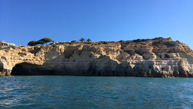 Summer Atlantic ocean rocky coastline near Carvoeiro town, Lagoa, Algarve, Portugal