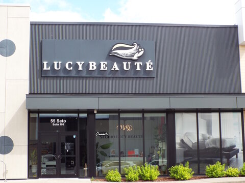 Gatineau, Quebec, Canada &ndash; June 13, 2026: A contemporary building, "Lucybeaute" storefront shows a bilingual sign reading lucy beaute above glass windows featuring an ouvert sign inside at 55 Rue de S