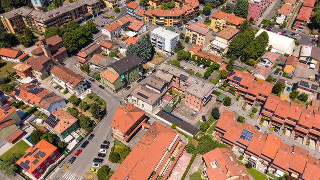 Aerial View of a European Town: An overhead drone perspective showcases the charming rooftops and winding streets of a quaint European town. Peschiera Borromeo, Italy