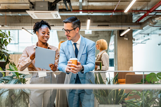 Business professionals collaborate in modern office setting