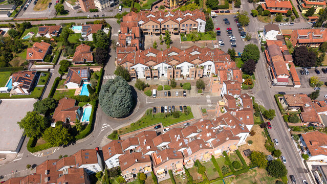Aerial View of Residential Area: An aerial perspective reveals a charming residential neighborhood with terracotta-roofed houses, Bellaria, Peschiera Borromeo, Italy