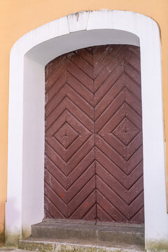 Old Wooden Church Door with Decorative Geometric Pattern.
