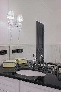 Luxury bathroom interior with black countertop