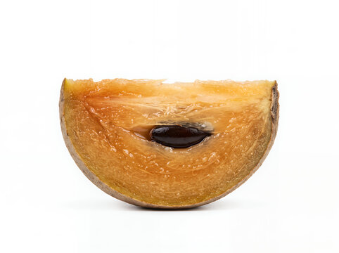 Sapodilla slice isolated on white background, tropical brown fruit.