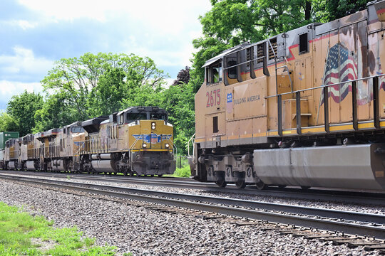 Union Pacific Railroad stack trains meet in west suburban Chicago. At. left, is an eastbound container train bound for Chciago, while at right a westbound intermodal freight is outbound from the city.