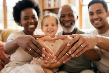 Obraz premium Diverse family forming a heart shape with their hands showcasing wedding rings