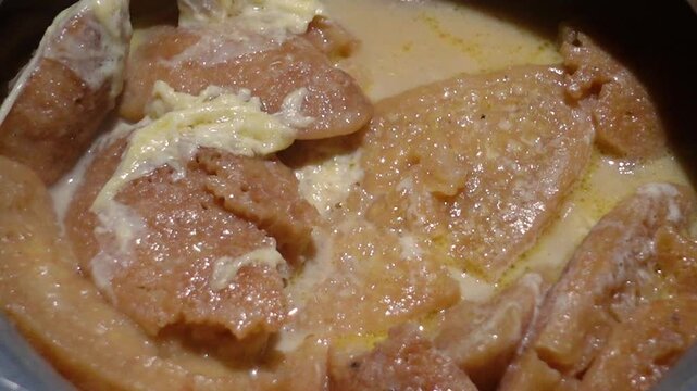 Date juice was cooked and turned red, and the Chitai Pitha was dipped in it, now milk is poured into it, which will be called Dudh-Chitai Pitha.