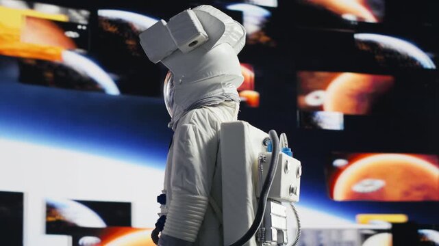 Astronaut floats in a space suit above Earth, representing human exploration, scientific discovery and the continuing journey into the unknown cosmos.