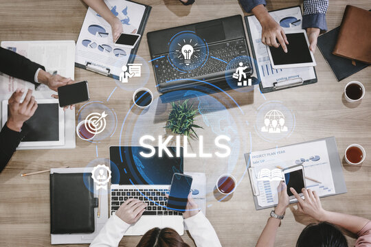 Collaborative Business Meeting Focused on Skill Development and Project Planning with Digital Devices and Visual Aids on a Conference Table. Entropy.