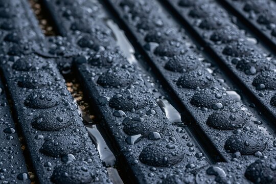 Waterproof rubber mats surface with studded grip nubs in deep slate for material backdrops