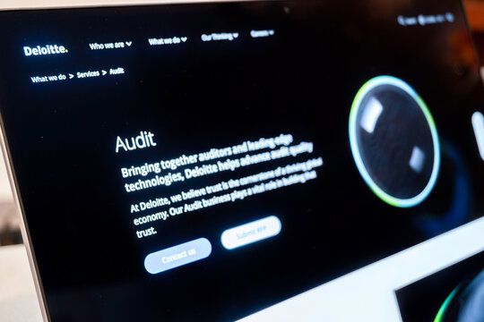 Mexico city, mexico, 02 23 2026: deloitte website displaying audit services on laptop screen