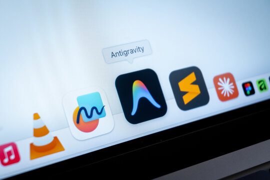Mexico City, Mexico, 02 25 2026: A laptop screen displays the macOS Dock featuring Google Antigravity extension, and VLC media player.