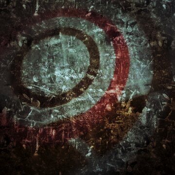 Abstract dark grunge background with distressed metallic textures and weathered circular patterns.