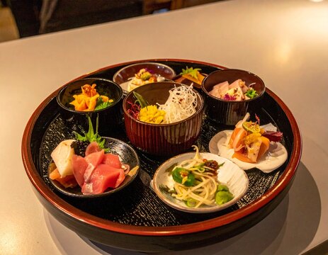 Traditional Japanese kaiseki meal with multiple small dishes featuring seasonal ingredients, artfully arranged on a lacquered tray, elegant fine dining atmosphere, copy space for stock photo