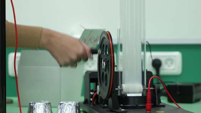 Hand Turning Crank on Van de Graaff Electrostatic Generator