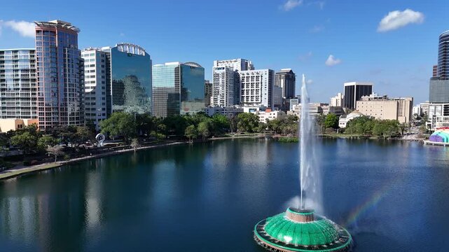 Flying by the fountain at Lake Eola in downtown Orlando in Orange County, Florida.