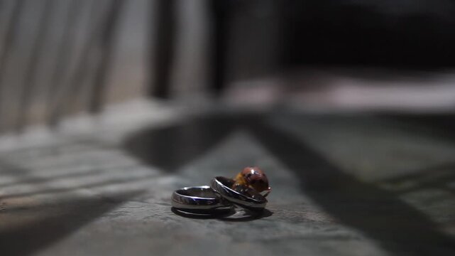 Macro View of Pair of Gold Wedding Bands and Engagement Ring