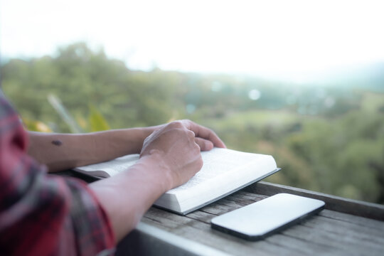 Close up of a man reading the Bible Spiritual concepts by studying the Holy Scriptures together, devotional concept