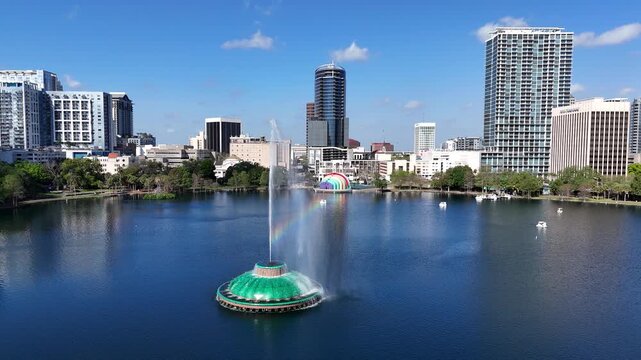 Flying by the fountain at Lake Eola in downtown Orlando in Orange County, Florida.