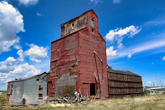 Old and Abandoned Red Grain Elevator in  Hilger, Montana. This beautiful old red grain elevator stands tall in Hilger, Montana at the crossroads of two state highways.