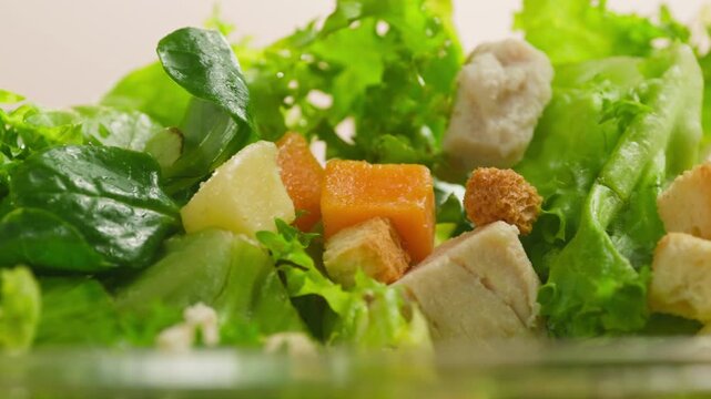 Caesar Dressing or Creamy Sauce Pouring Over Fresh Green Caesar Salad Leaves in Bowl, Close Up of Healthy Food Preparation, Restaurant and Cafe Cooking Concept