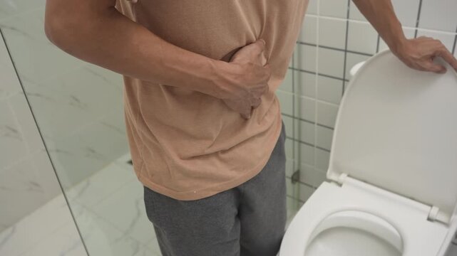 Constipation and diarrhea in bathroom. Hurt man touch belly  stomach ache painful. colon inflammation problem, toxic food, abdominal pain, abdomen, constipated in toilet, stomachache, Hygiene