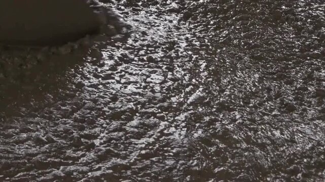 Wet concrete pouring during construction work