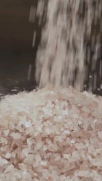 Pink Himalayan Salt Falling onto a Pile