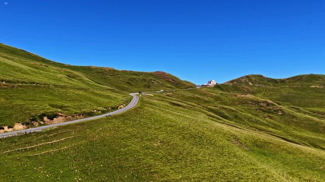 Aerial Drone Tracking Along Mountain Road with Hikers at Col d'Aubisque, French Pyrenees
