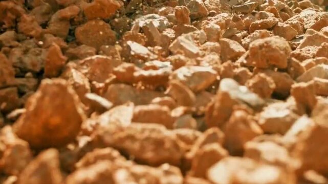 Close-up of Brown Rocks and Gravel Falling in Slow Motion