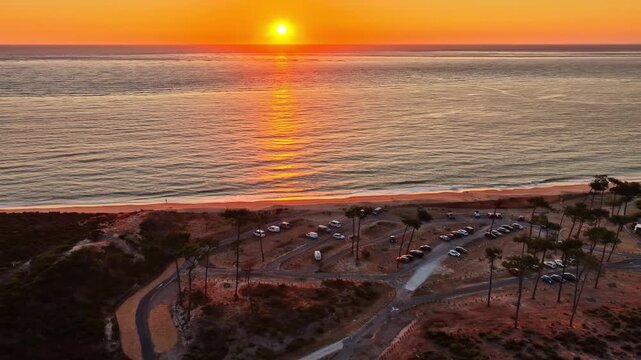 Golden sunset reflecting over the ocean near the Dune du Pilat in France