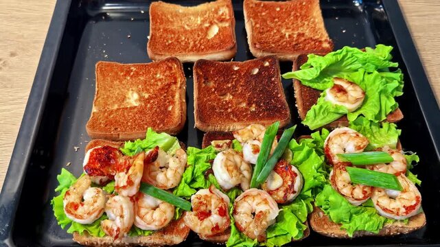 Timelapse shows step by step assembly of shrimp toast sandwiches with lettuce yellow peppers and drizzled creamy sauce