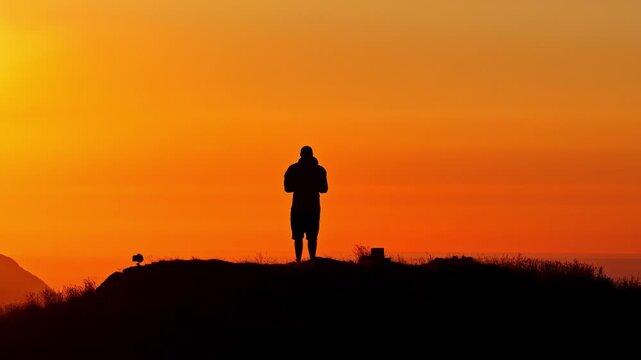 Aerial Tracking Shot of Drone Pilot Silhouette at Golden Hour Sunset on Col d'Aubisque, French Pyrenees, France