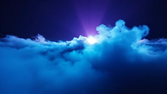 Epic heavenly clouds with bright light bursting through the top of the fluffy blue clouds creating dramatic and beautiful atmosphere