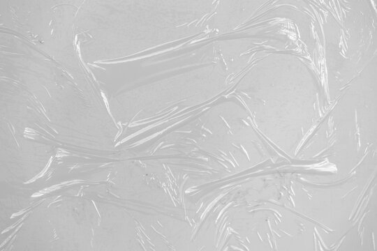 plastic overlay texture of realistic crumpled transparent plastic film wrap on white background, wrinkled stretched plastic effect. plastic background on transparent png