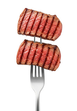 Two pieces of grilled beef steak meat on a metal fork for a delicious dinner meal concept isolated on transparent background