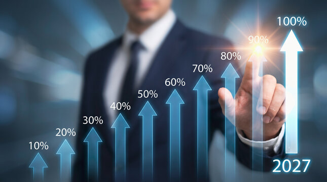 Businessman interacting with digital growth chart showing annual progress