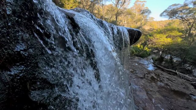 Waterfall Cascading Over Rock Ledge in Blue Mountains National Park