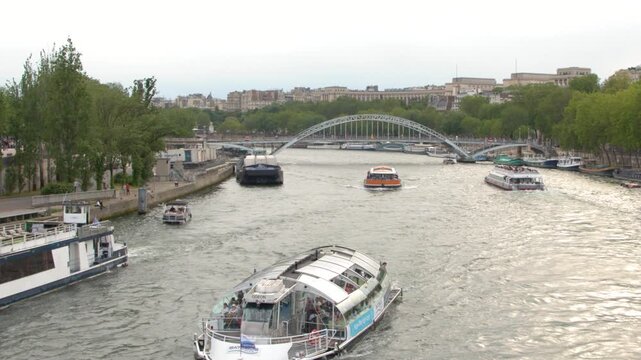 Tourist Cruise Boats Navigating the Seine River in Paris France