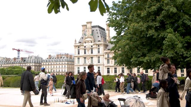 Tourists Walking in Tuileries Garden Near the Louvre Museum in Paris