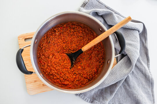 homemade vegetarian lentil bolognese sauce in big pot on kitchen counter