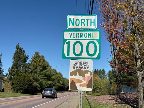 Vermont Route 100 North and Green Mountain Byway signs beside a rural road - Stowe, Vermont, USA - September 30, 2025